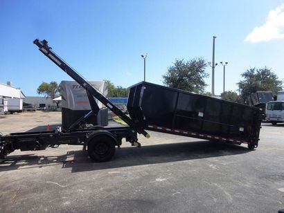 truck lowering dumpster