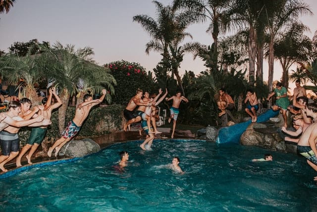 Men enjoying 4th july at pool